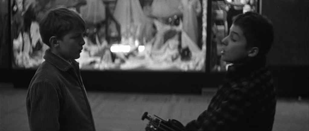 What Is a Coming-of-Age Movie? Definition Themes & Film Examples 3 Two boys talk outside a store window at night in a still from The 400 Blows