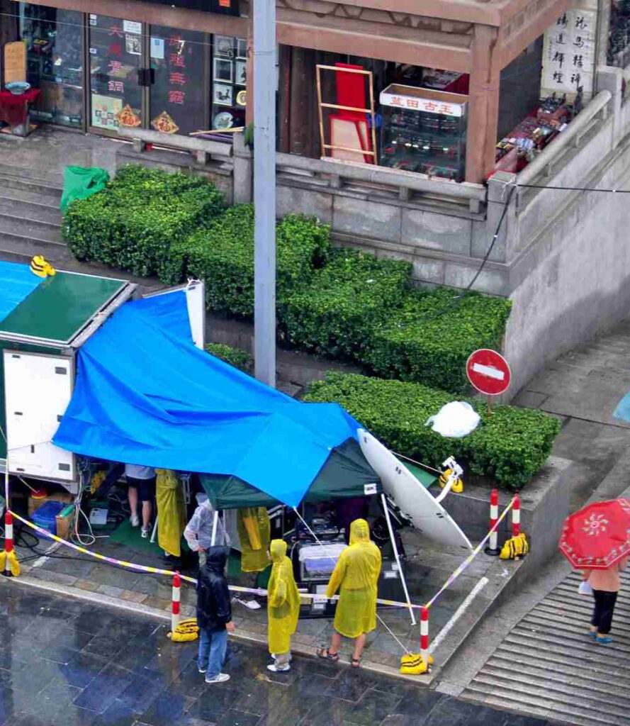 14 Tips For Protecting Your Camera Gear From Bad Weather 7 Tarp on film set in bad weather