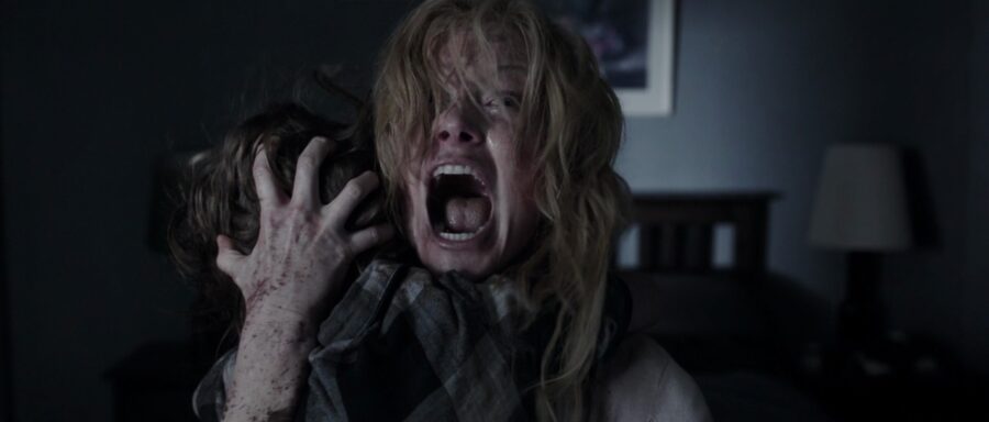 What is The Hollywood Model (aka "Berettermodellen")? Definition & Examples 10 A terrified woman screams while clutching a child in a dark bedroom, hair and face wild with fear