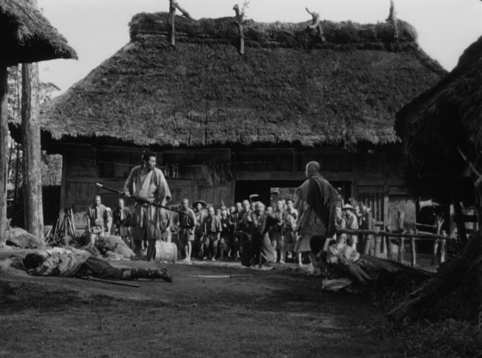 30 Films Every Budding Film Student Should Watch & Why 14 A samurai stands with a spear in a village courtyard, with a dead body on the ground and villagers watching in the background.
