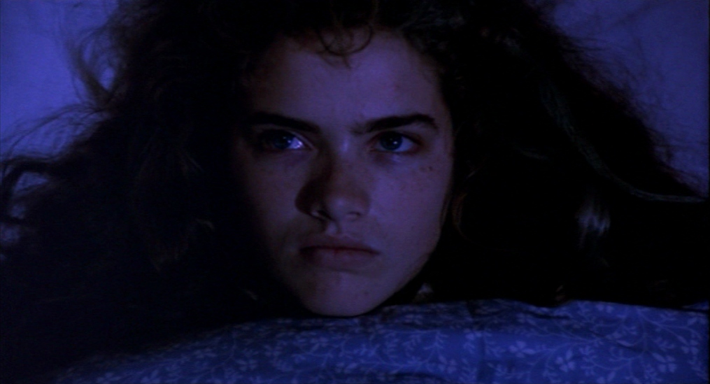 Film Genre Analysis: What Sets Horror and Thriller Apart? 4 Nancy staring forward with determination in bed
