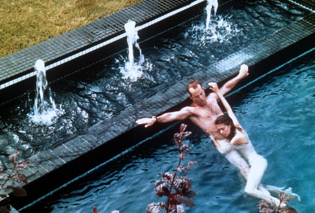 Film Genre Analysis: What Sets Horror and Thriller Apart? 5 Bruce Willis and Jane March embrace in a pool in Color of Night