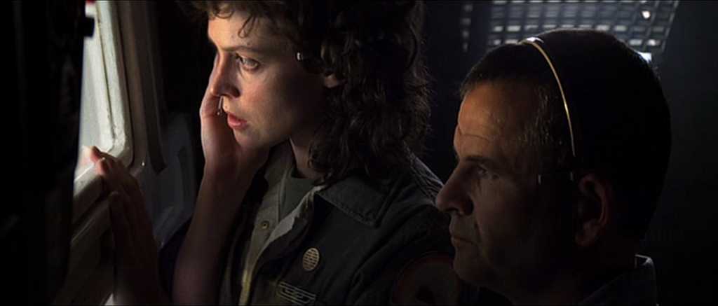 Film Genre Analysis: What Sets Horror and Thriller Apart? 8 Ripley and a crew member peer anxiously out a spaceship window in Alien