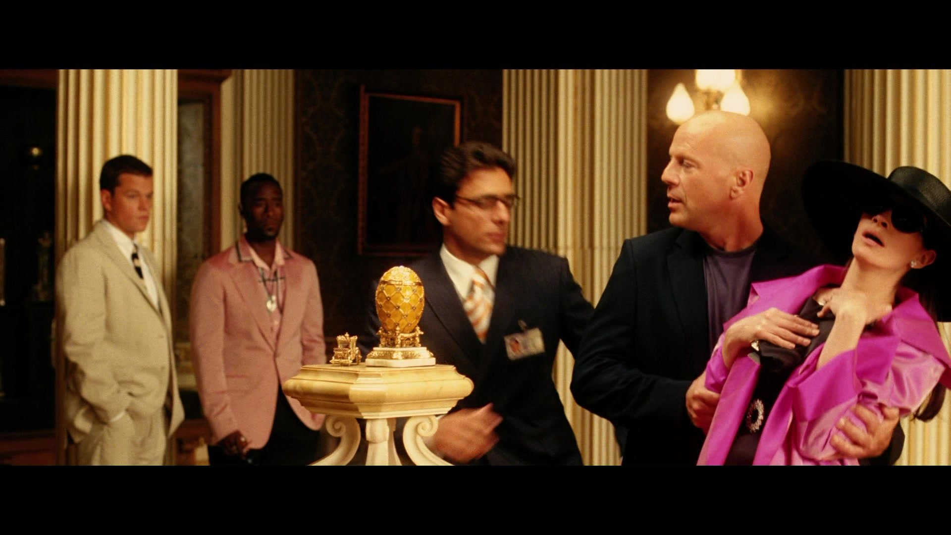 What Is A MacGuffin? Definition + Good & Bad Examples Explained 10 A Fabergé egg sits on display while characters in formal clothing stand nearby in Ocean’s Twelve.