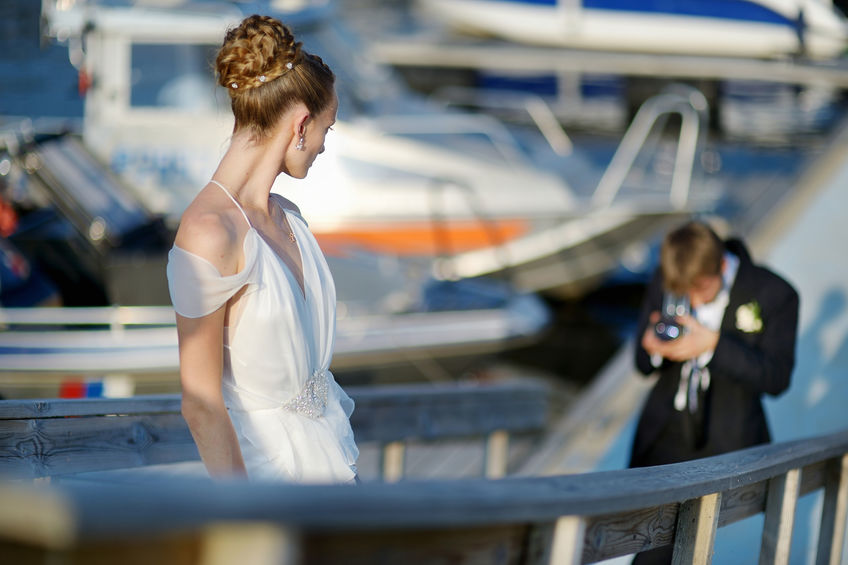 Bride posing for wedding videographer