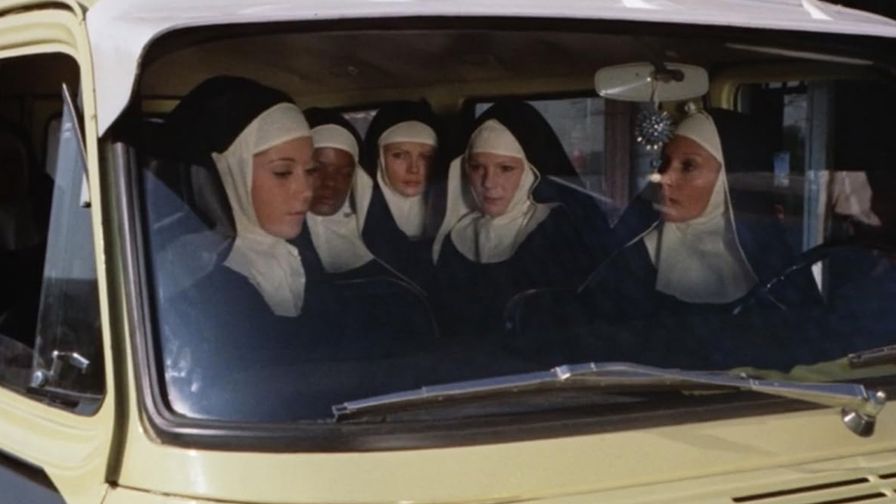 Sexy Female Prison Movies Too Taboo For Today's Audience 8 A group of women in nun outfits sit inside a van in The Big Bust-Out (1972)