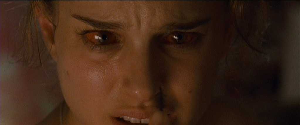 What Is an Antagonist? Meaning, Role & Film Examples 21 Nina’s face fills the frame, eyes red and frightened as she loses control.