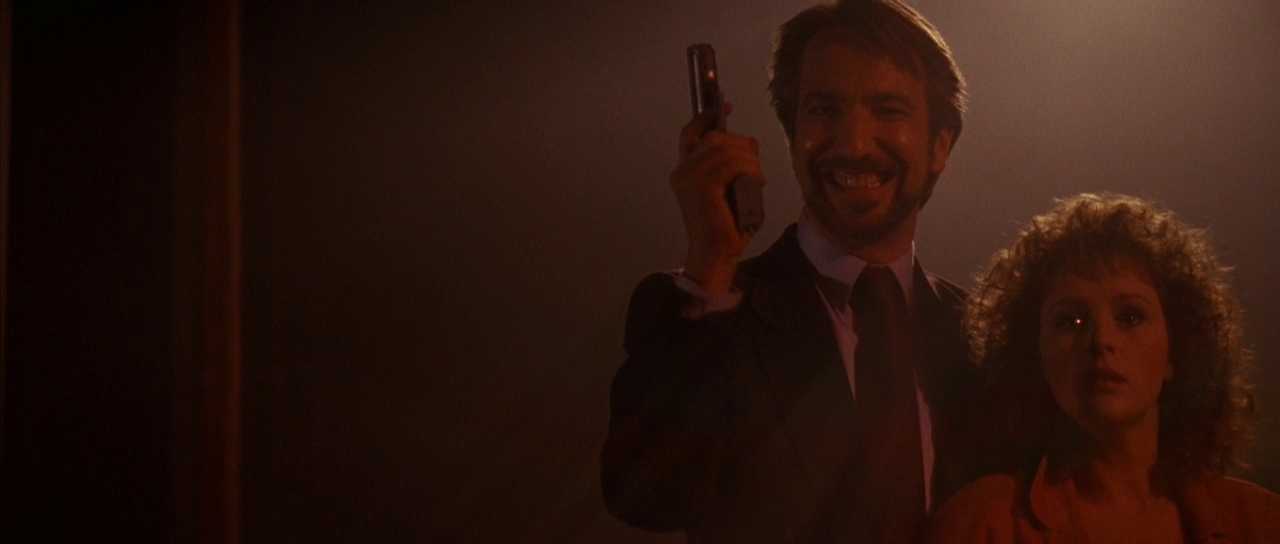 Climax in Film. Definition and Examples From Famous Movies. 2 Hans Gruber smiling with a gun while holding Holly Gennaro hostage in the final confrontation