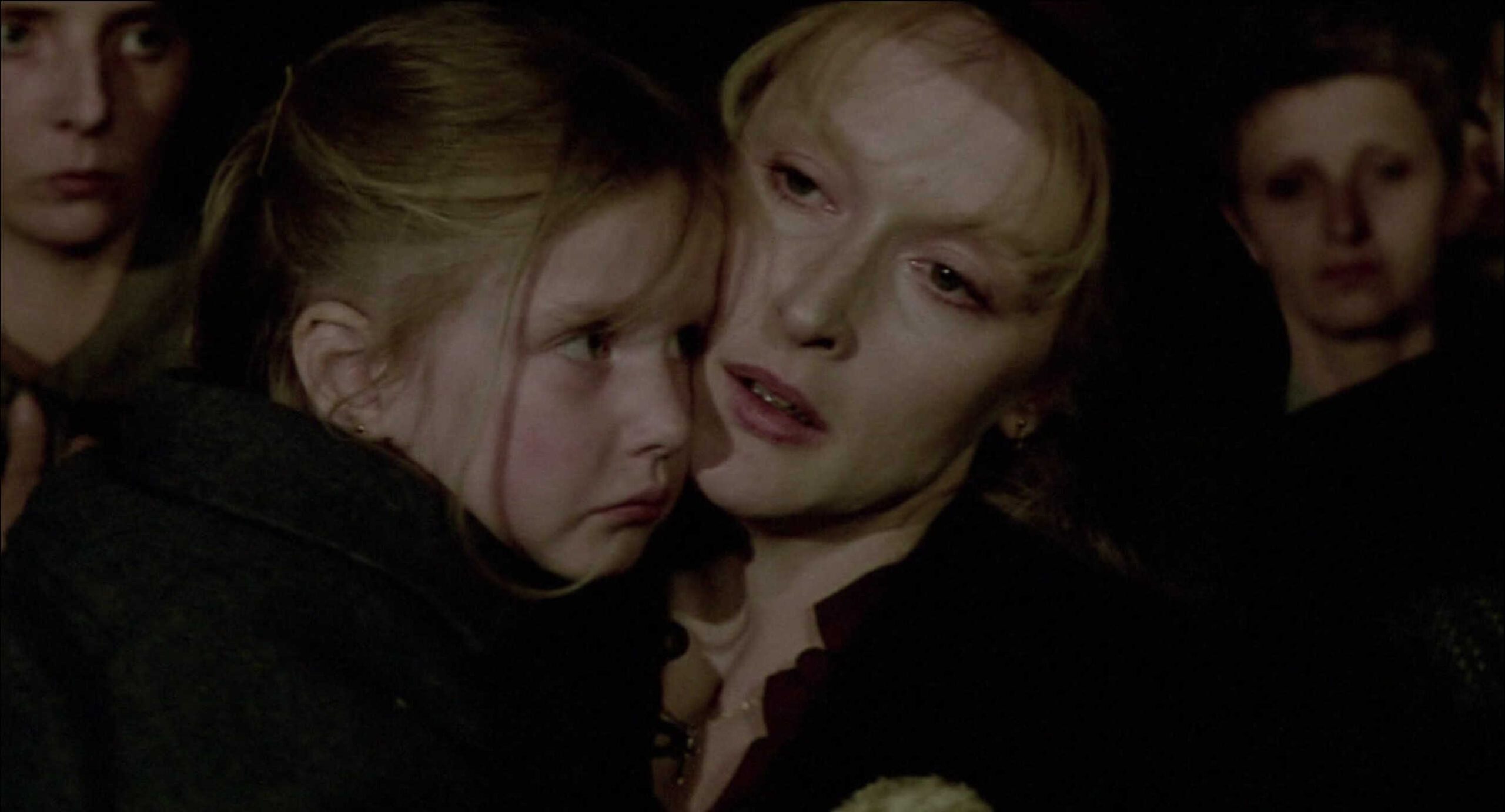 What Is Conflict in Film? Meaning, Types & Film Examples 7 Sophie holds her child tightly while people wait during a Nazi selection under harsh conditions.