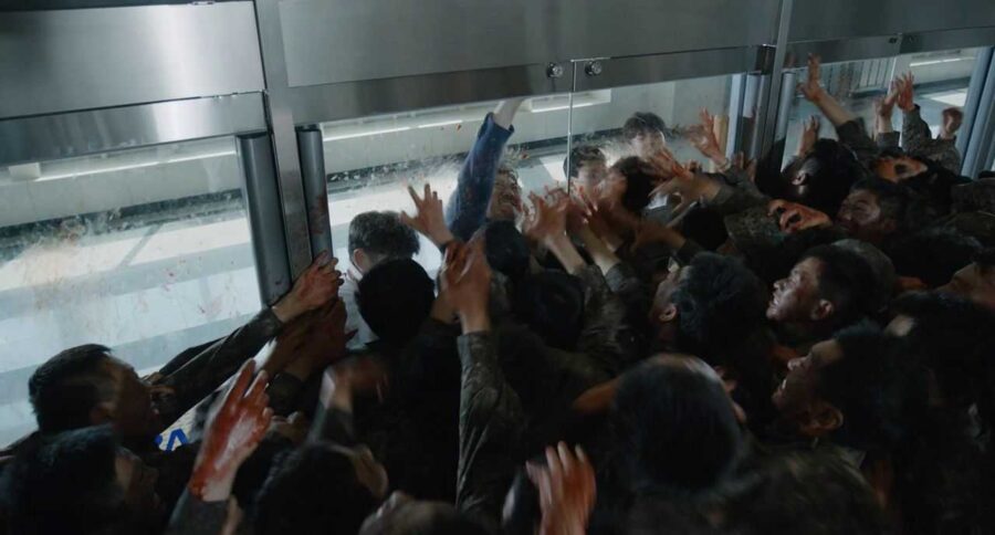 What Is an Antagonist? Meaning, Role & Film Examples 18 A mass of zombies presses forward as survivors scramble for safety.