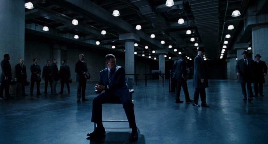 What Is an Antagonist? Meaning, Role & Film Examples 17 Two characters move through a controlled environment, suggesting a system steering their choices.