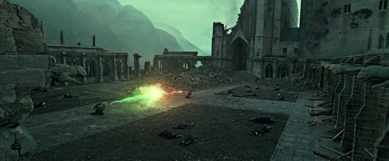 What Is Conflict in Film? Meaning, Types & Film Examples 6 Harry and Voldemort duel with red and green magic beams in a damaged Hogwarts courtyard.