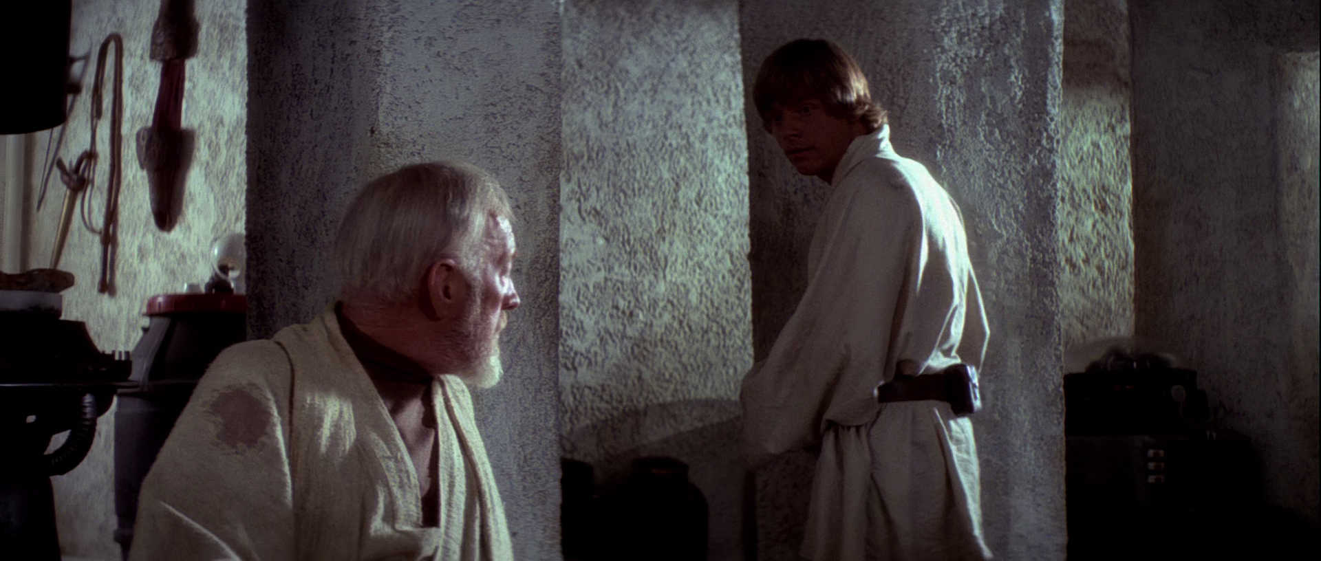What is The Hero’s Journey? Story Structure Explained with Star Wars 4 Luke looks hesitant as he turns away from Obi-Wan inside a small, stone-walled room on Tatooine.