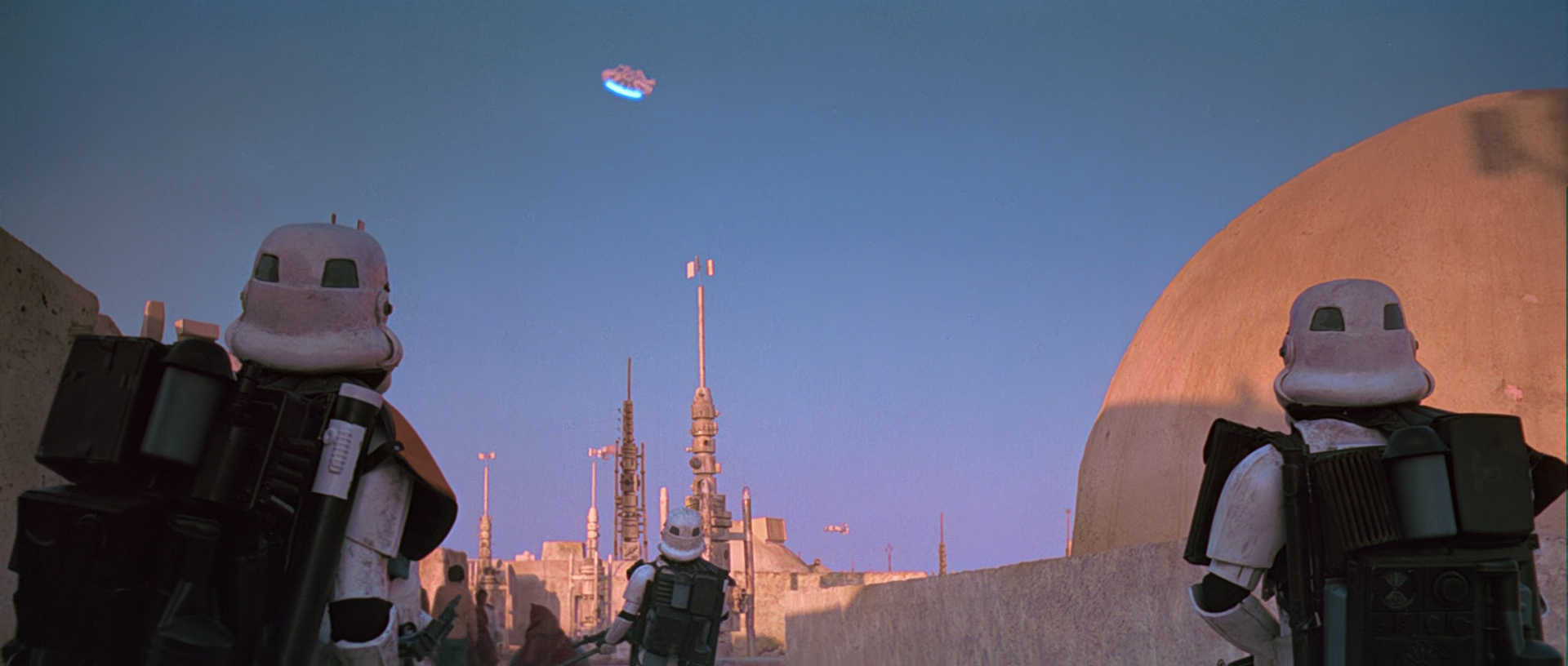 What is The Hero’s Journey? Story Structure Explained with Star Wars 6 Stormtroopers look up as the Millennium Falcon blasts off into the sky from Mos Eisley.