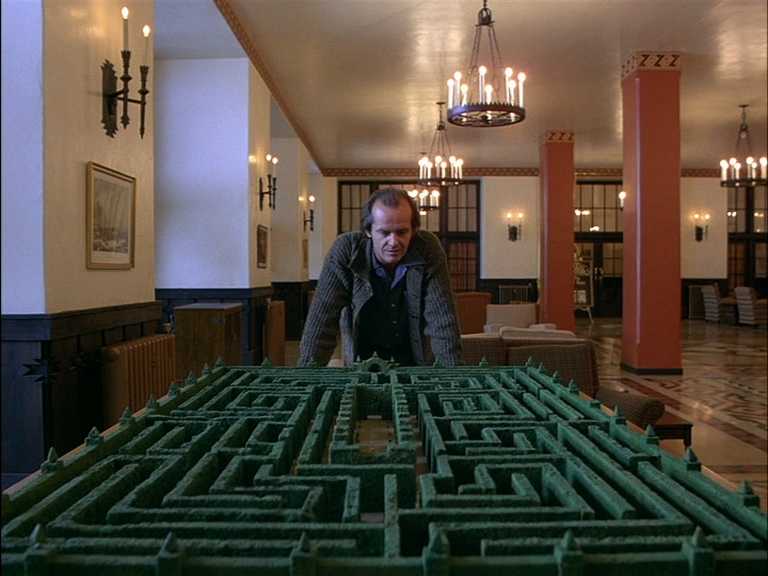 Foreshadowing in Film. Definition, Techniques & Examples 5 Jack Torrance leans over a scale model of a hedge maze inside the Overlook Hotel’s bright, formal lobby.
