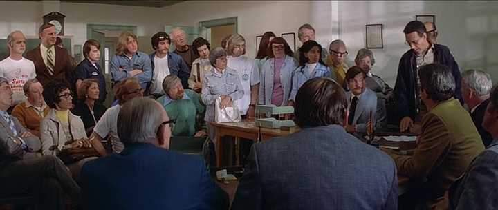 What is a Narrative in Film? Meaning, Definition & Structure Examples. 2 A crowded town council meeting room packed with residents as Martin Brody stands at the right side of the table, arguing with officials seated in front of him.