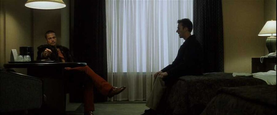 What Is an Antagonist? Meaning, Role & Film Examples 15 Tyler Durden and the Narrator stand together in a tense moment, suggesting inner conflict.