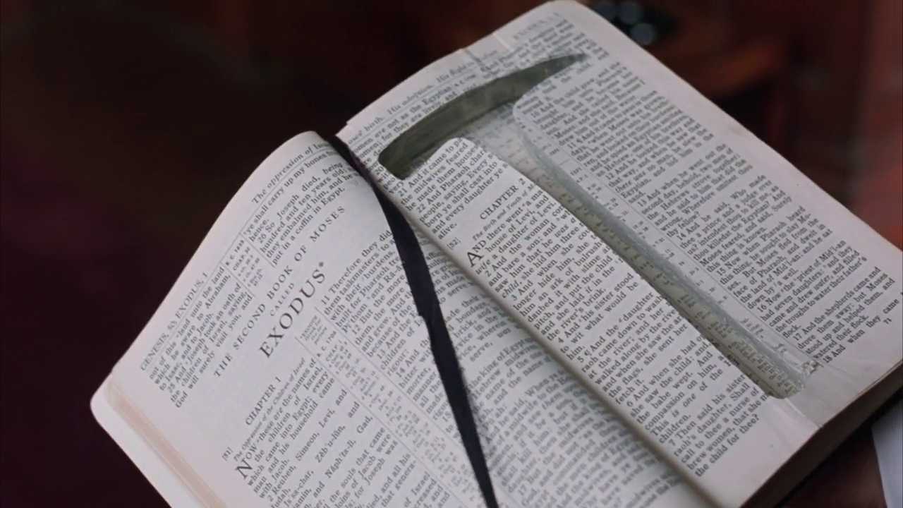 Foreshadowing in Film. Definition, Techniques & Examples 3 An open Bible turned to the Book of Exodus with a black ribbon bookmark, with Andy’s rock hammer lying across the pages.