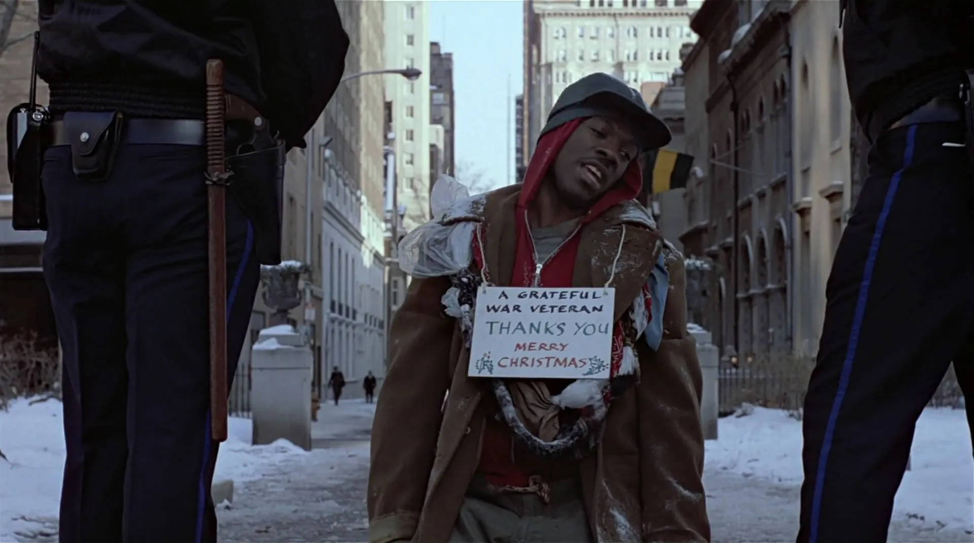 Peripeteia in Film. Definition, Meaning & Examples 3 Billy Ray Valentine sits in the snow between two police officers and holds a sign that says “A grateful war veteran… Merry Christmas.
