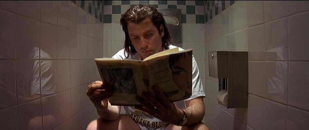 What is Auteur Theory? Definition, Meaning & Examples 5 Vincent Vega sits on a toilet reading a paperback book, a quiet moment that precedes a major plot twist in Quentin Tarantino’s non-linear Pulp Fiction.