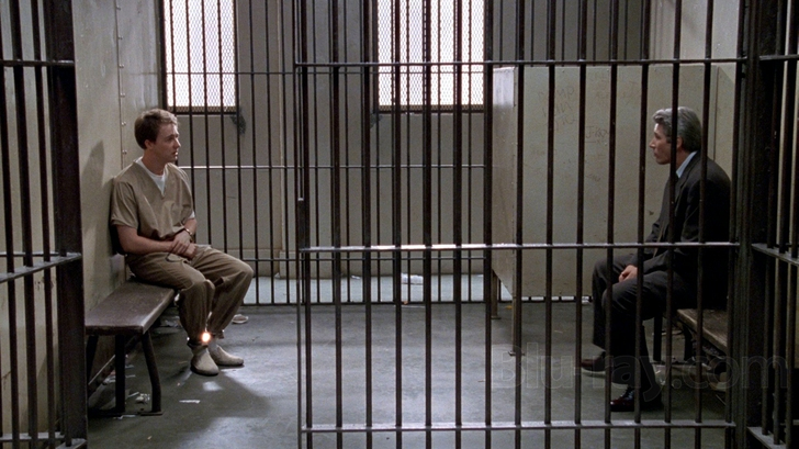 What is Anagnorisis? Definition & Examples from Film 8 Aaron sits in a jail cell across from his lawyer, separated by bars, with tension in the air.