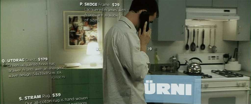 Analogy Explained: Meaning, Function + Film Examples 7 A man on the phone in his kitchen, with IKEA-style product listings overlaid on the scene in Fight Club