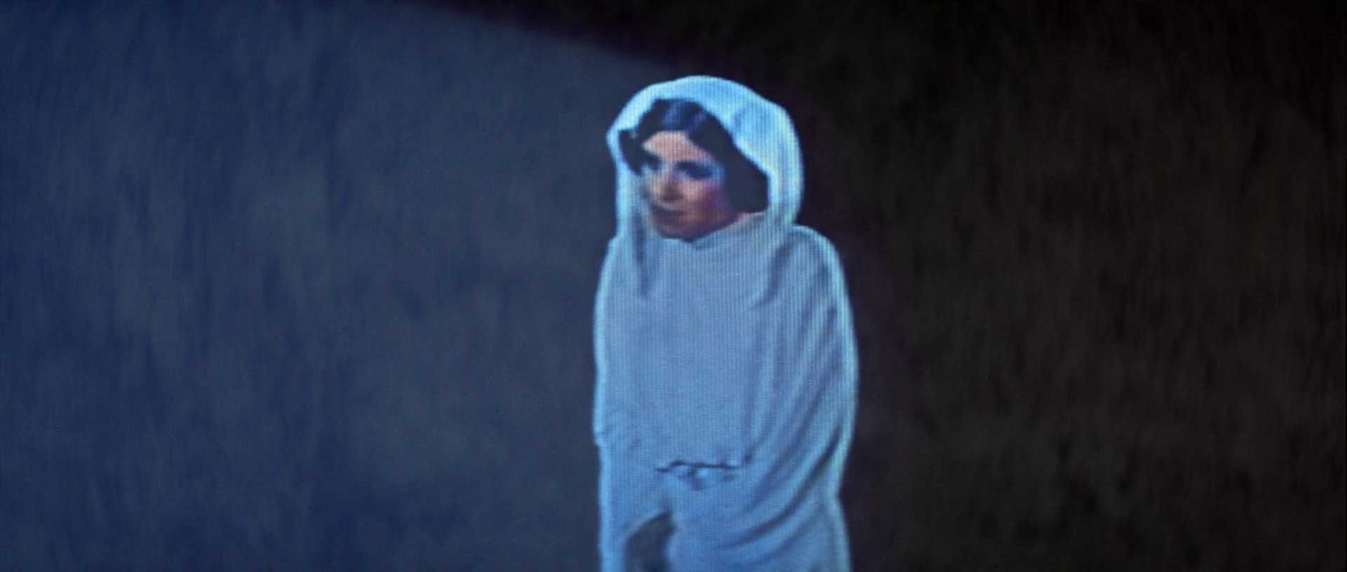 What Is a Stock Character? Definition & Film Examples 4 Princess Leia stands in a white hooded outfit inside a dark corridor, framed alone in blue light.