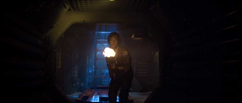 What Is an Archetype? Definition & Clear Film Examples 3 Ripley stands in a dark spaceship corridor with a flamethrower, and a burst of flame lights her face and chest.