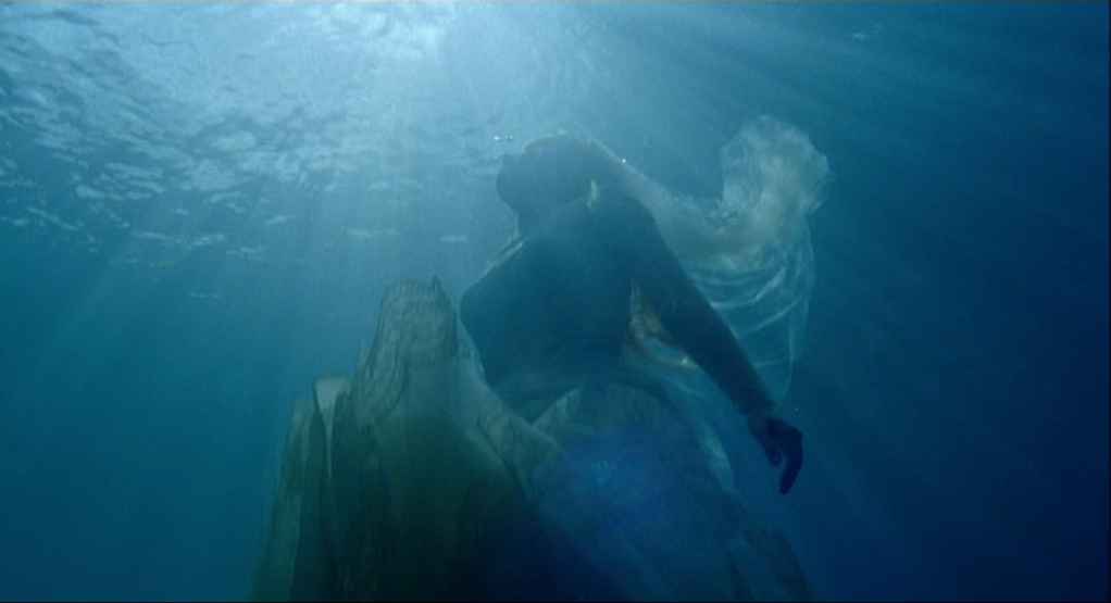 What Is Impressionism in Art & Film? Definition & Examples 13 A person drifts underwater in a flowing, translucent dress while pale light filters down from the surface above.