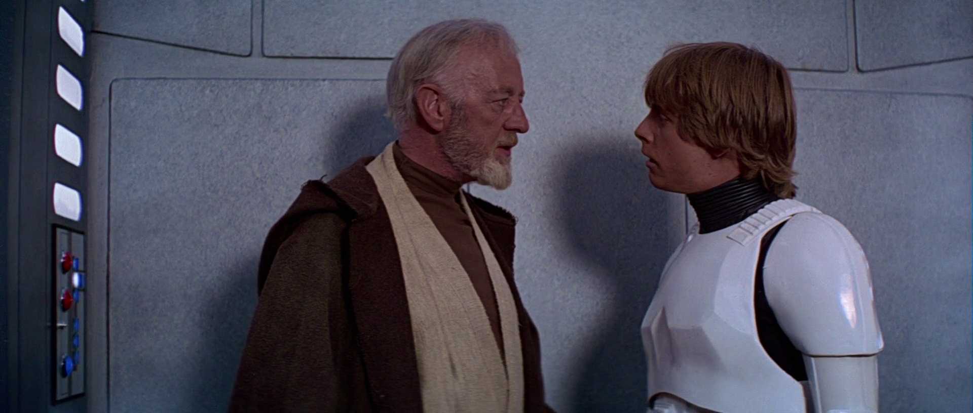 What Is a Backstory in Film? Definition & Famous Examples 6 Obi-Wan Kenobi talks to Luke Skywalker, who wears a stormtrooper outfit inside a smooth grey corridor aboard the Death Star.