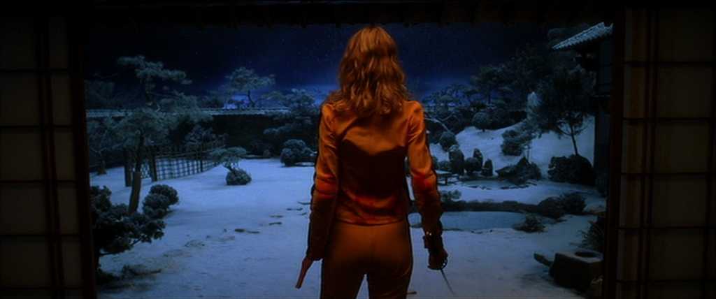 Cowboy shot framing in Kill Bill: Volume 1 (2003) Film still framed in a cowboy shot that crops the subject from mid-thigh to head, keeping hands visible.