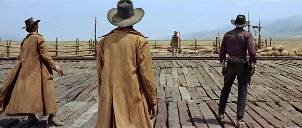 What Is a Spaghetti Western? Definition, History & Style 6 Three men in dusters wait at a train station in Once Upon a Time in the West (1968)