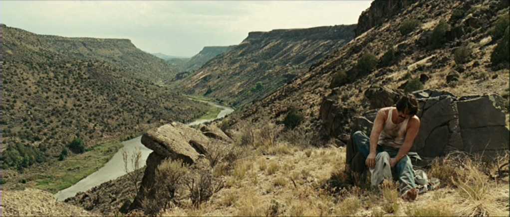 What Is a Spaghetti Western? Definition, History & Style 7 Man sits alone in a desert valley in No Country for Old Men (2007)