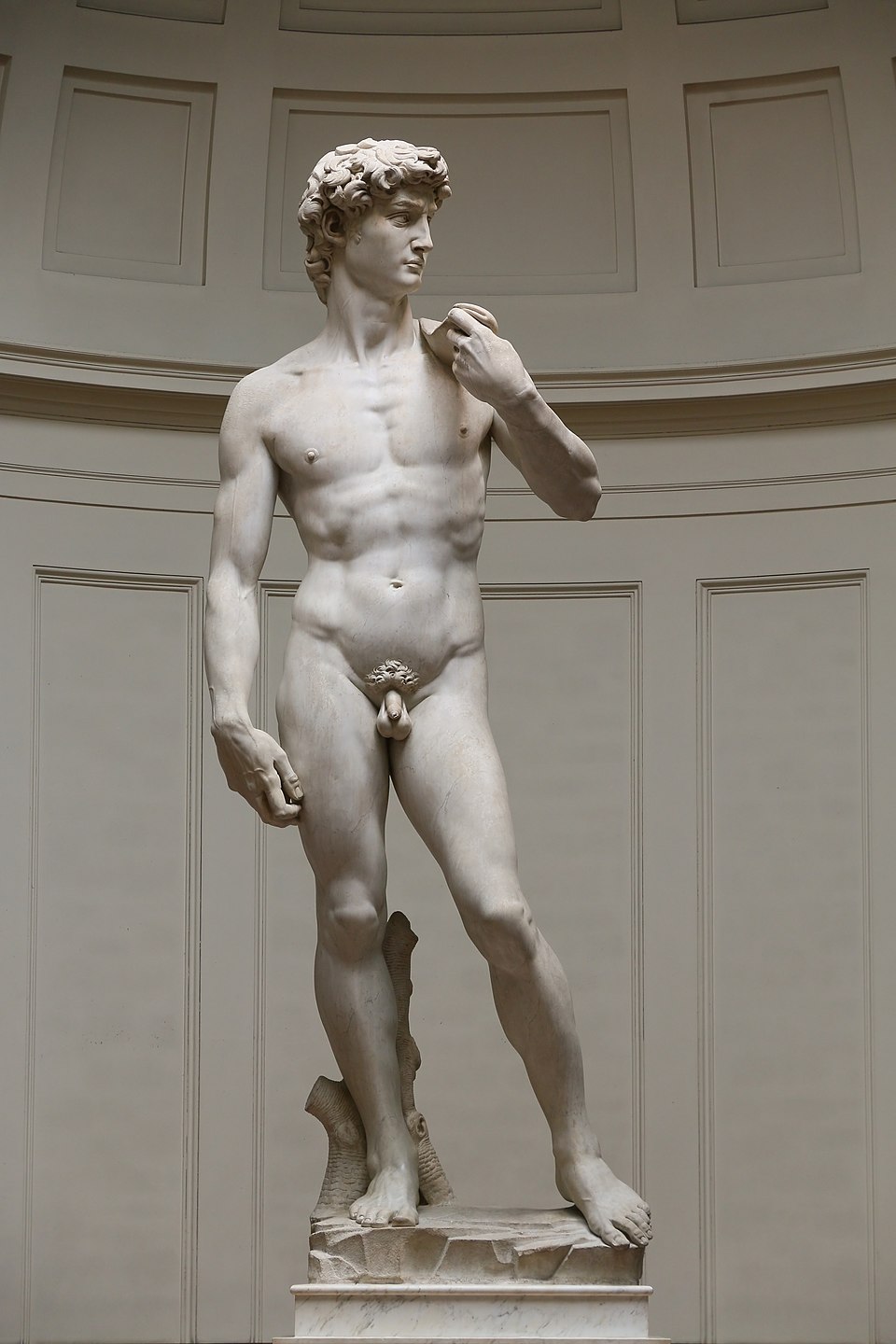 What Is Scale in Art? Definition, Types & Famous Examples 4 Marble statue of a nude male figure standing in contrapposto, with defined muscles and focused gaze