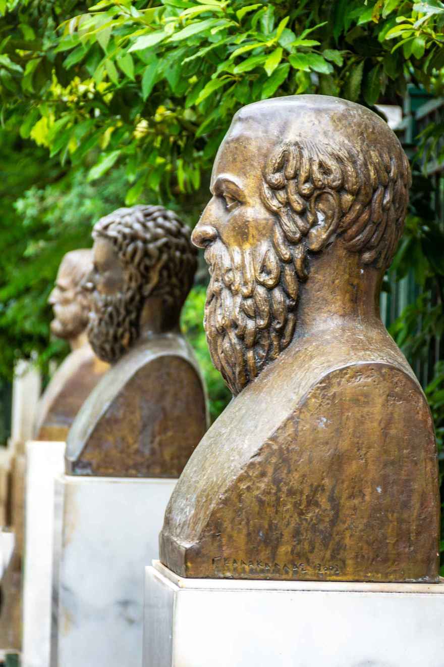 What Is Drama? Definition, Subgenres, and Themes 4 Bronze busts of Greek playwrights lined up outdoors