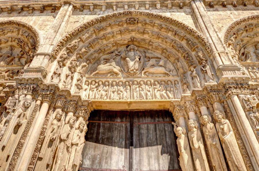 What Is Gothic Art? Definition, History & Examples 7 Stone sculptures of saints and biblical scenes carved into the main portal of Chartres Cathedral, France