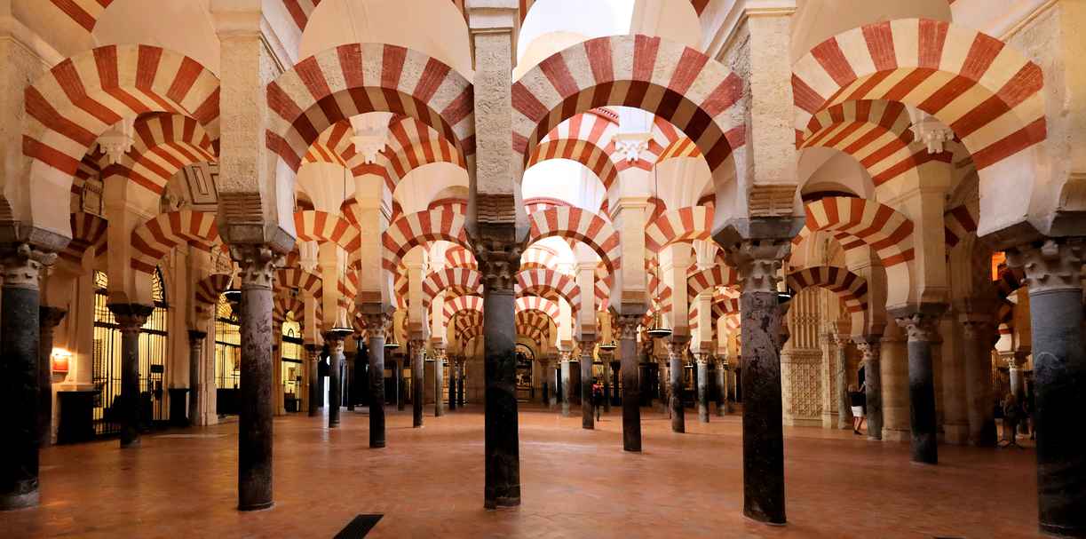 What Is Rhythm in Art? Definition and Examples 3 Repeating red and white arches in the Mosque–Cathedral of Córdoba