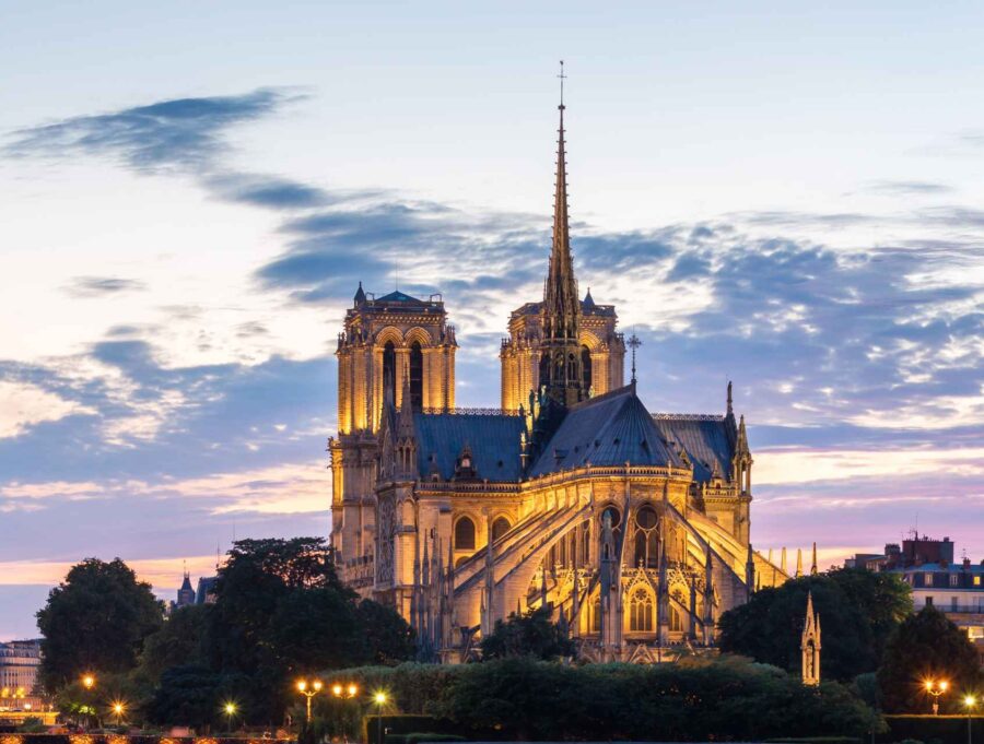 What Is Gothic Art? Definition, History & Examples 4 Exterior of Notre-Dame de Paris with flying buttresses at sunset