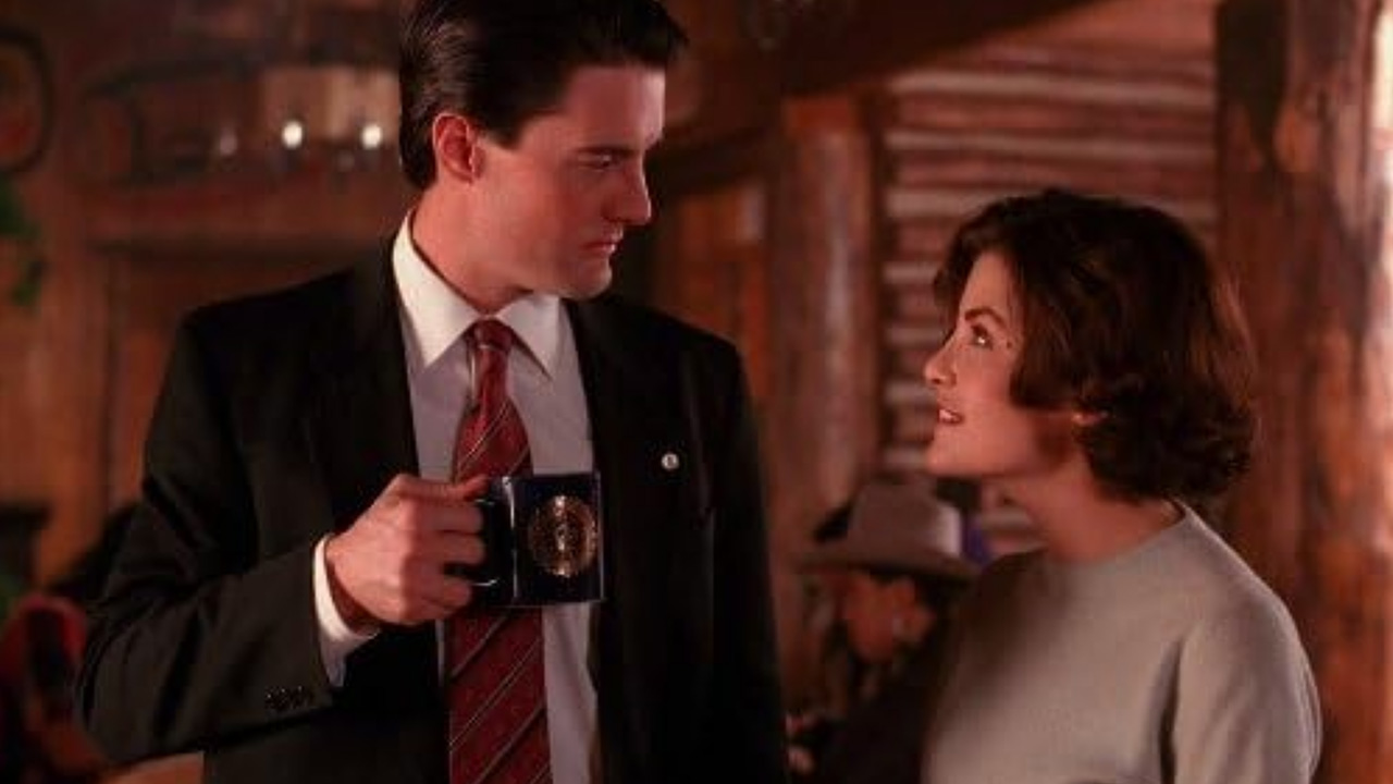 What Is a Soap Opera? Definition, Traits & TV Origins 3 Sherilyn Fenn and Kyle MacLachlan talking in a log cabin diner in Twin Peaks