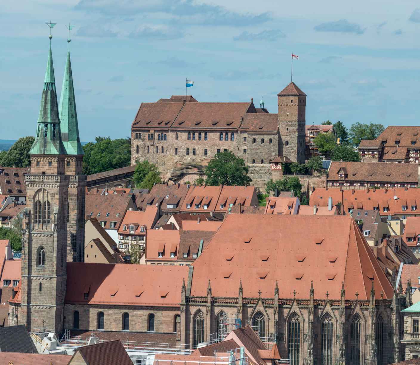 What Is Gothic Art? Definition, History & Examples 13 Exterior of St. Lorenz Church with twin spires and red-tiled roof in Nuremberg