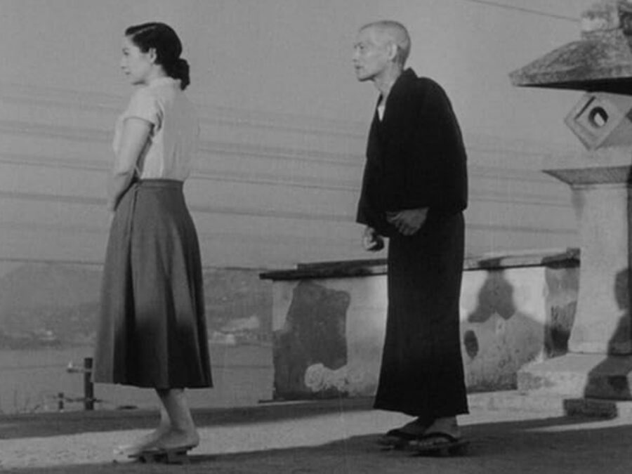 What Is Drama? Definition, Subgenres, and Themes 6 Elderly man and young woman standing apart in a black-and-white scene from Tokyo Story