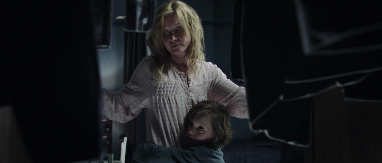 What Is a Horror Movie? Definition, Subgenres & Examples 8 Mother and child standing in a dark closet