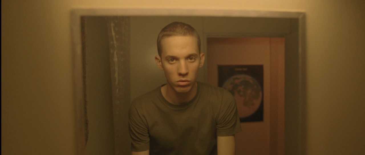 What Is Subjective Cinema? POV Filmmaking, VR, and Emotion 4 A young man with a shaved head stares into a mirror in a dimly lit hallway