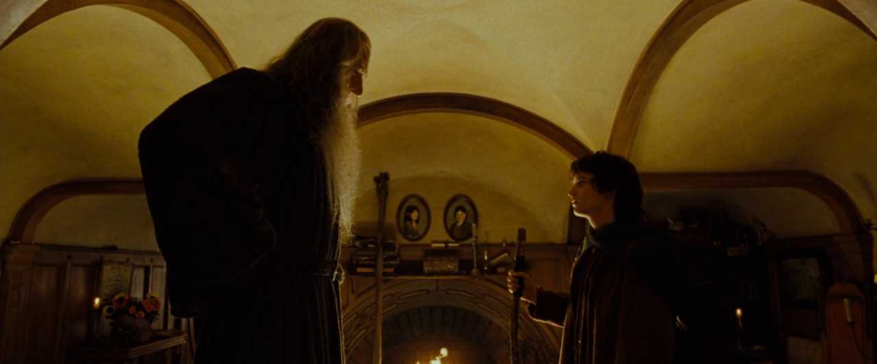Similarities & Differences Between Science Fiction & Fantasy in Film Explained 7 Gandalf and Frodo talk inside a warm, round-walled hobbit home