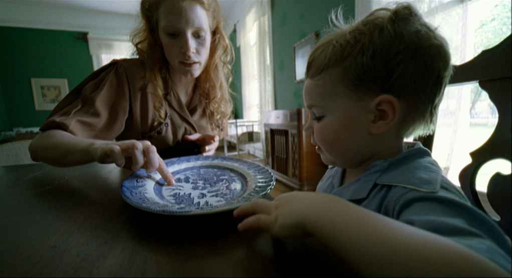 What Is Subjective Cinema? POV Filmmaking, VR, and Emotion 6 A mother and young boy sit at a table as she points to a blue plate, in a warmly lit room