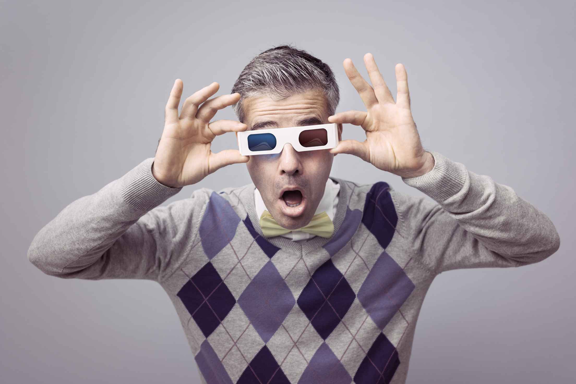 What Is a 3D Movie? Definition, History & Examples 3 Man surprised while wearing old-style red-blue 3D glasses