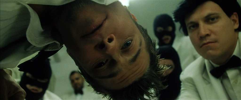 What is First-Person Point-of-View? Definition & Examples 5 Brad Pitt leans into the camera from above, surrounded by men in white uniforms and black masks