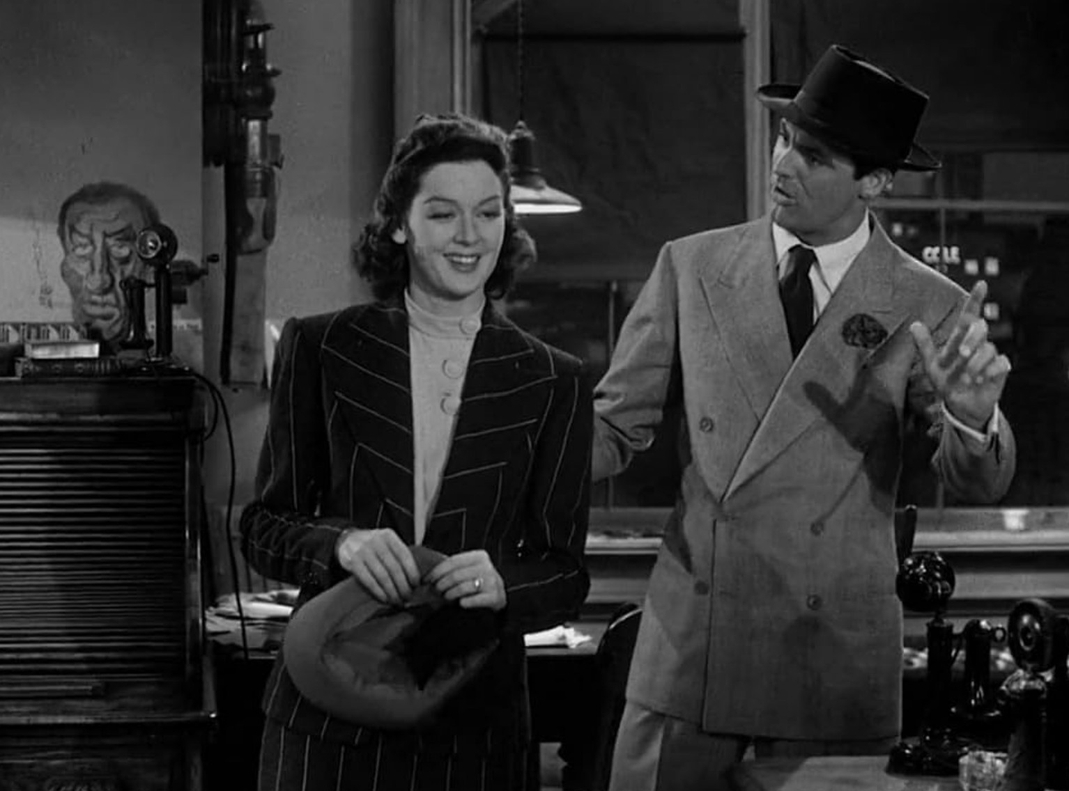 What is a Romcom? Definition, History & Tropes 11 Cary Grant and Rosalind Russell argue in an office in His Girl Friday (1940)