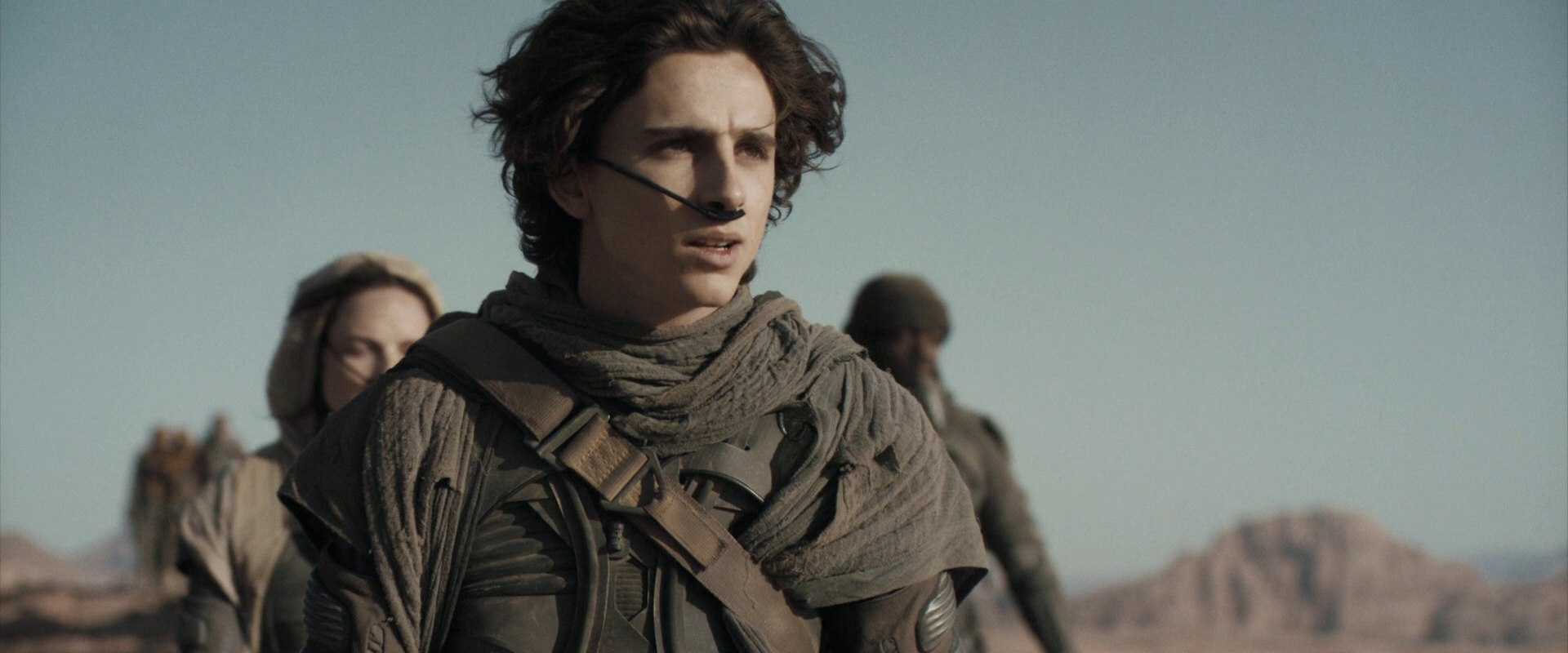 What Is Science Fiction? Definition & Film Origins Explained 2 Paul Atreides in desert survival gear with a breathing tube across his face in Dune