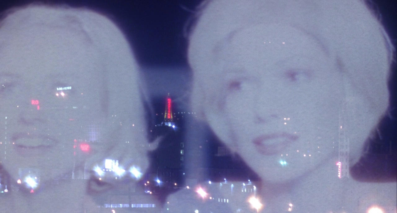 What Is Subjective Cinema? POV Filmmaking, VR, and Emotion 5 Double exposure of Naomi Watts’ face over a nighttime cityscape, glowing with soft lights